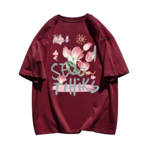 A maroon shirt with an abstract, hand-painted floral design and street-style typography.